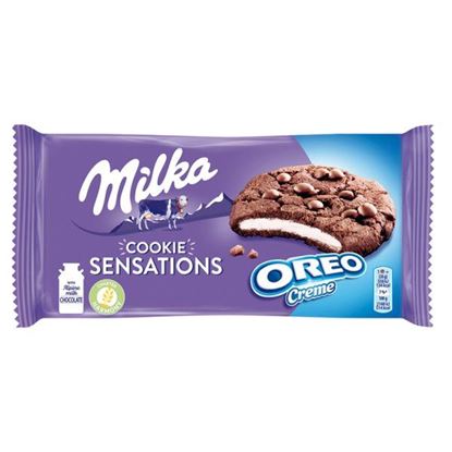 Milka Cookie Sensations Ciastka kakaowe z kawałkami czekolady i nadzieniem o smaku waniliowym 156 g